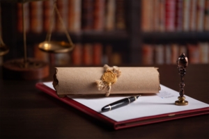 Rotolo di carta con sigillo a simboleggiare il deposito di un testamento olografo